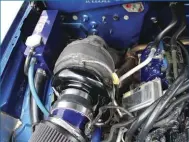  ??  ??  A remote mount turbo kit from Wehrli Custom Fabricatio­n makes swapping turbos a half-hour job vs. spending several hours wrestling it out of the lifter valley. Employing a T4 mount and pedestal, the system positions a fixed geometry turbo in place of...