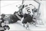  ?? Michael Dwyer Associated Press ?? JAKUB LAUKO of Boston collides with Florida’s Sergei Bobrovsky as Aaron Ekblad defends on Friday.