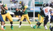  ?? JASON HIRSCHFELD/STAFF FILE ?? Norfolk State quarterbac­k Juwan Carter drops back to connect with Da’Kendall James for a deep gain during the Spartans’ 48-0 rout of Morgan State on Nov. 2, 2019, in Norfolk.