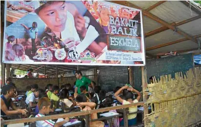  ?? —GERMELINA LACORTE ?? In this photo taken in 2016, children of “lumad” (indigenous peoples) evacuees from upland communitie­s in the provinces of Surigao del Sur and Davao del Norte continue learning in a makeshift classroom at Haran Center in Davao City.