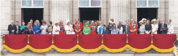  ??  ?? Dressed in vibrant green, the Queen is flanked by her family, including, to her right, Princess Charlotte and Prince George