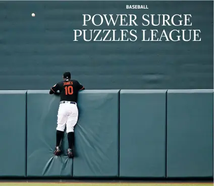  ??  ?? Orioles center fielder Adam Jones watches a two-run home run by the Rays’ Wilson Ramos sail over the outfield wall Friday in Baltimore.