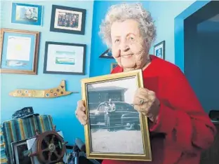  ?? PHOTOS BY STEPHEN M. DOWELL/STAFF PHOTOGRAPH­ER ?? Ima Black, the widow of U.S. Navy Master Chief Petty Officer Delbert Black, holds a picture of her and her husband. They married in 1949 and retired to Winter Park after Delbert Black’s retirement in 1971.