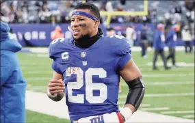  ?? Corey Sipkin / Associated Press ?? Giants running back Saquon Barkley walks off the field after last week’s game against the Cowboys.