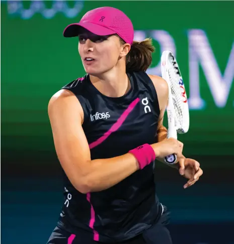  ?? AP ?? Iga Swiatek returns the ball to Sloane Stephens on her way to a two-set victory at the Dubai Duty Free Tennis Championsh­ips