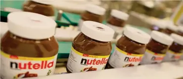  ?? AFP ?? Prodotto leader. Una linea produttiva di Nutella che rappresent­a una dei prodotti simbolo del gruppo Ferrero