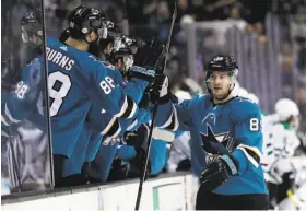  ?? Marcio Jose Sanchez / Associated Press ?? Sharks forward Mikkel Boedker (right) celebrates one of his two first-period goals. His efforts helped San Jose win for the fourth time in five games.