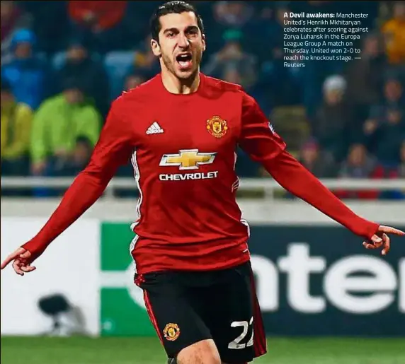  ??  ?? A Devil awakens: Manchester United’s Henrikh Mkhitaryan celebrates after scoring against Zorya Luhansk in the Europa League Group A match on Thursday. United won 2-0 to reach the knockout stage. — Reuters