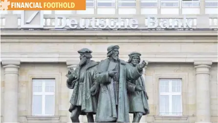  ?? — Reuters ?? A statue stands in front of the logo of Germany’s Deutsche Bank AG in Frankfurt.