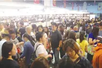  ?? WWW.MANILABOOK­FAIR.COM ?? PEOPLE flock to the Manila Internatio­nal Book Fair. This year there will be around 200 exhibitors spread over two floors at the SMX Convention Center.