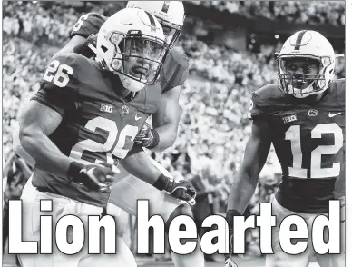  ??  ?? RALLY BIG WIN: Penn State’s Saquon Barkley celebrates his fourth-quarter touchdown against Wisconsin on Saturday, which helped lift the Nittany Lions to their first conference title in eight years. USA TODAY Sports