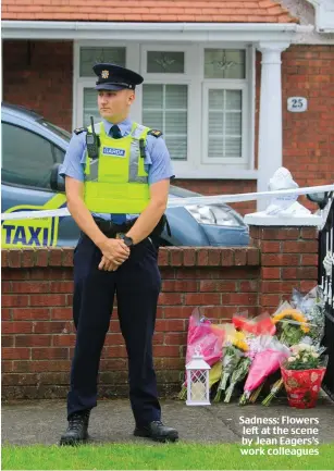  ??  ?? Sadness: Flowers left at the scene by Jean Eagers’s work colleagues