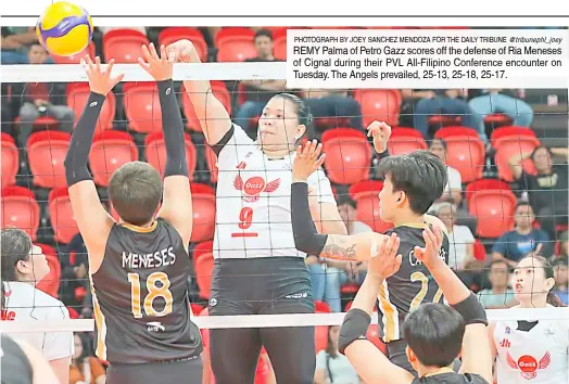 ?? PHOTOGRAPH BY JOEY SANCHEZ MENDOZA FOR THE DAILY TRIBUNE @tribunephl_joey ?? REMY Palma of Petro Gazz scores off the defense of Ria Meneses of Cignal during their PVL All-Filipino Conference encounter on Tuesday. The Angels prevailed, 25-13, 25-18, 25-17.
