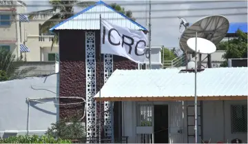  ??  ?? The flag of the Internatio­nal Committee of the Red Cross (ICRC) at their compound where armed men kidnapped a German nurse Wednesday evening, in Wadajir district of Mogadishu, Somalia. — AFP photo