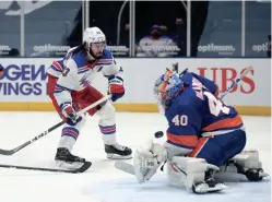  ?? BRAD PENNER/USA TODAY SPORTS ?? Islanders goalie Semyon Varlamov (40) makes a save on a shot by Rangers center Mika Zibanejad (93) during the second period Tuesday at Nassau Veterans Memorial Coliseum.