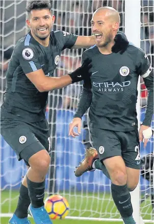  ??  ?? SILVA LINING Man City ace David Silva savours his opener with team-mate Sergio Aguero