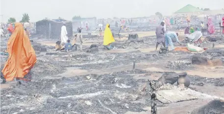  ?? AUDU MARTE/AGENCE FRANCE-PRESSE ?? DESTROYED tents at Muna Alamdiri camp near Maiduguri, Nigeria after a fire hit the shelter for displaced people in northeast Nigeria. At least two children died and more than a thousand tents were destroyed in the fire, according to emergency officials.