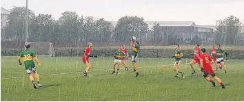  ??  ?? Wild weather The Harps didn’t let the conditions rain on their parade as they won again