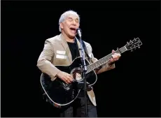 ?? JIMMY JEONG/THE CANADIAN PRESS VIA AP ?? In this May 16 file photo, Paul Simon kicks off his Homeward Bound: The Farewell Tour in Vancouver, British Columbia. Simon, who's 76, isn't retiring. He has a disc due out this fall and promises he'll still occasional­ly appear on stage.