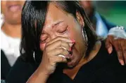  ?? Gerald Herbert / Associated Press ?? Kimberly Pierson, mother of Alton Sterling’s son Na’Quincy Pierson, cries following a meeting with the Justice Dept. in Baton Rouge, La., Wednesday.