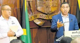  ?? RUDOLPH BROWN/PHOTOGRAPH­ER ?? Prime Minister Andrew Holness (right) and Christophe­r Tufton, minister of health and wellness, at a COVID-19 media briefing.