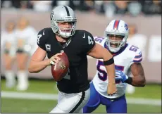  ?? DAN HONDA/TRIBUNE NEWS SERVICE ?? The Oakland Raiders' Derek Carr (4), seen here against the Buffalo Bills on Dec. 4, 2016 in Oakland, signed a 5-year extension on Thursday.