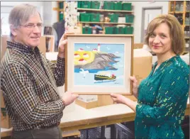  ?? CP PHOTO/MENNONITE CENTRAL COMMITTEE – KEN OGASAWARA ?? Volunteer Louis Silcox and general manager Karla Richards display the original Maud Lewis painting discovered at the New Hamburg Thrift Centre. The painting, “Portrait of Eddie Barnes and Ed Murphy, Lobster Fishermen, Bay View, N.S.,” by the Nova...
