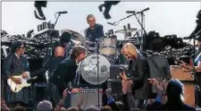  ?? COURTESY PHOTO/TIME LIFE ?? From left, Paul McCartney, Ringo Starr and Joe Walsh perform at the 30th Annual Rock and Roll Hall of Fame Induction Ceremony in 2015.