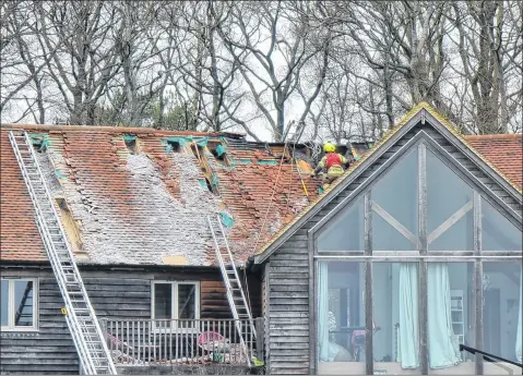  ?? Picture by Ben Wood ?? Fire crews spent 14 hours dealing with the blaze at the property in Snelsmore Common