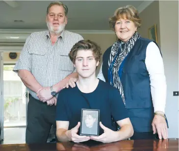  ??  ?? Tim Potter of Yarragon with a photograph of his late mother Katy, a former sailor with the Royal Australian Navy, and grandparen­ts Judy and Ian Potter who raised him since Katy died. Tim will be among 90 Junior Legatees travelling to France this month...