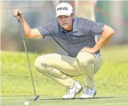  ??  ?? Johannes Veerman lines up a putt on the opening day of the Queen’s Cup.