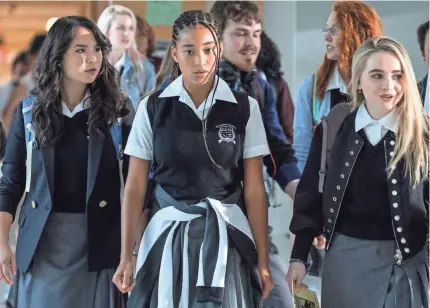  ?? ERIKA DOSS ?? Amandla Stenberg, center, stars as a teen girl who turns activist after she witnesses her friend gunned down by police in “The Hate U Give,” in theaters in October. It’s based on a YA Black Lives Matter novel by Angie Thomas.