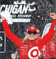  ?? AP/PAUL SANCYA ?? Driver Kyle Larson celebrates his victory in the Michigan 400 on Sunday at Michigan Internatio­nal Speedway in Brooklyn, Mich. Martin Truex Jr. finished second.