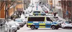  ??  ?? VAN polis menutup jalan di luar mahkamah di mana Rakhmat dibawa di Stockholm, semalam. - Reuters