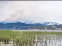  ?? DARRYL DYCK/THE CANADIAN PRESS ?? While some areas in B.C. hit by wildfires received rain Monday, the Shovel Lake fire was not one of them.