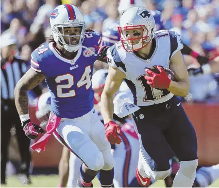  ?? AP PHOTO ?? PLAYING FROM BEHIND: Cornerback Stephon Gilmore chases Julian Edelman during one of the Bills’ many losses to the Patriots. The teams meet again Sunday at New Era Field.
