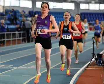  ??  ?? Anne Gilshinan (Slaney Olympic) on her way to victory in the Over-50 800m in Athlone.