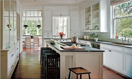  ?? JOHN COLE PHOTOGRAPH­Y/WASHINGTON POST ?? A kitchen with wood floors by Donald Lococo Architects and designer Darryl Carter.