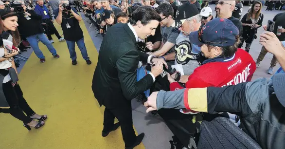  ?? ETHAN MILLER/GETTY IMAGES ?? Vegas Golden Knights goaltender Marc-Andre Fleury signs autographs for fans before the expansion team’s first home game at T-Mobile Arena on Tuesday.