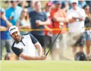  ?? AP PHOTO/ALASTAIR GRANT ?? Louis Oosthuizen plays out of a bunker in July during the British Open Golf Championsh­ip in Carnoustie, Scotland. Saturday Oosthuizen was back in front at the South African Open with a three-shot lead.