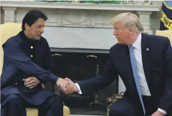  ?? Reuters ?? President Donald Trump greets Prime Minister Imran Khan in the Oval Office yesterday. Mr Trump held out the possibilit­y of restoring US aid to Pakistan