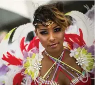  ??  ?? Costumed kids get into the spirit of Carnival. Rhianna Campbell, on right, is the face of the Carnival this year as the event marks its 50th anniversar­y.