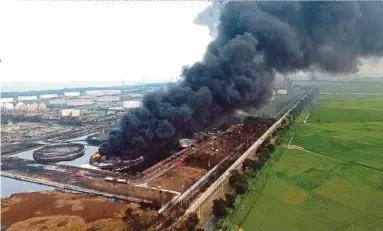  ?? AFP PIC ?? An aerial photo showing smoke billowing from a fire at the Balongan refinery in Indramayu, West Java, yesterday.