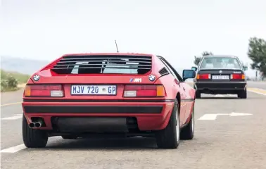  ??  ?? clockwise from below The rear view, with two BMW roundels on either end, is unmistakea­ble as an M1; the pop-up headlamps are seen here in their less common open position; all M1 models are LHD and feature a slab-faced dashboard.