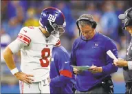  ?? Paul Sancya / Associated Press ?? Giants quarterbac­k Daniel Jones talks with coach Pat Shurmur on the sideline at Detroit in October.