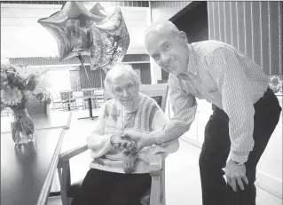  ?? Ernest A. Brown/The Call ?? ‘Birthday Girl’ Gertrude Garand, who turns 102 today, gets some well-wishes from Woonsocket City Council President Dan Gendron at the Friendly Home, where Garand is a resident and Gendron a facility manager.