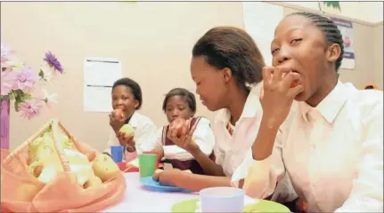  ?? Picture: ?? HUNGRY: The future of soup kitchens in the Province is uncertain following confusion over whether regular funding will be received from the Department of Social Developmen­t. Seen here are children enjoying a meal at the Selelo House in Warrenton, which...
