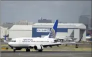  ?? MEL EVANS — THE ASSOCIATED PRESS FILE ?? In this file photo, a United Airlines passenger plane lands at Newark Liberty Internatio­nal Airport in Newark, N.J. Twitter users are poking fun at United’s tactics in having a man removed from an overbooked Chicago to Louisville flight on.