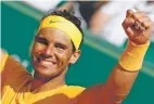  ?? CHRISTOPHE ENA/THE ASSOCIATED PRESS ?? Spain’s Rafael Nadal celebrates winning the men’s singles final match of the Monte Carlo Tennis Masters on Sunday against Japan’s Kei Nishikori, 6-3, 6-2, in Monaco.