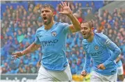  ?? (AFP) ?? Manchester City's Sergio Aguero (left) celebrates after scoring against Cardiff City in Cardiff, UK, on Saturday